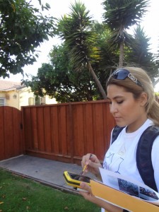 Garden to Table volunteer collects fruit tree data with the Trimble Juno SB mobile device.